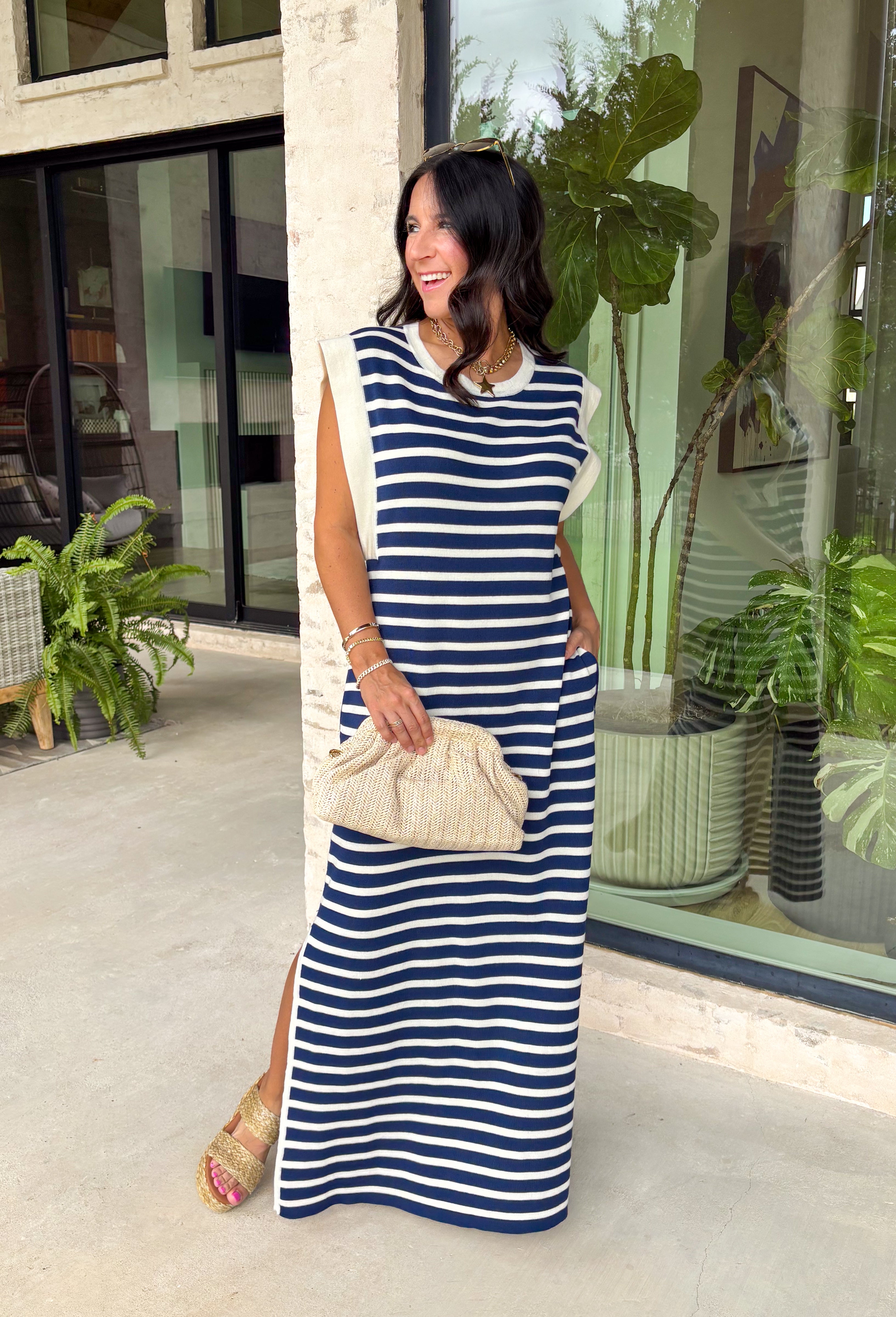 This navy and off white striped maxi dress is the effortless summer staple you'll reach for again and again! The classic stripe print gives it a timeless, coastal-inspired feel, while the contrast rib trim at the neckline and armholes adds a sporty touch. Lightweight and incredibly comfortable, it has that easy throw-on-and-go style that works for everything from vacation days to weekend errands. And with side pockets (always a win), it's as practical as it is cute. 