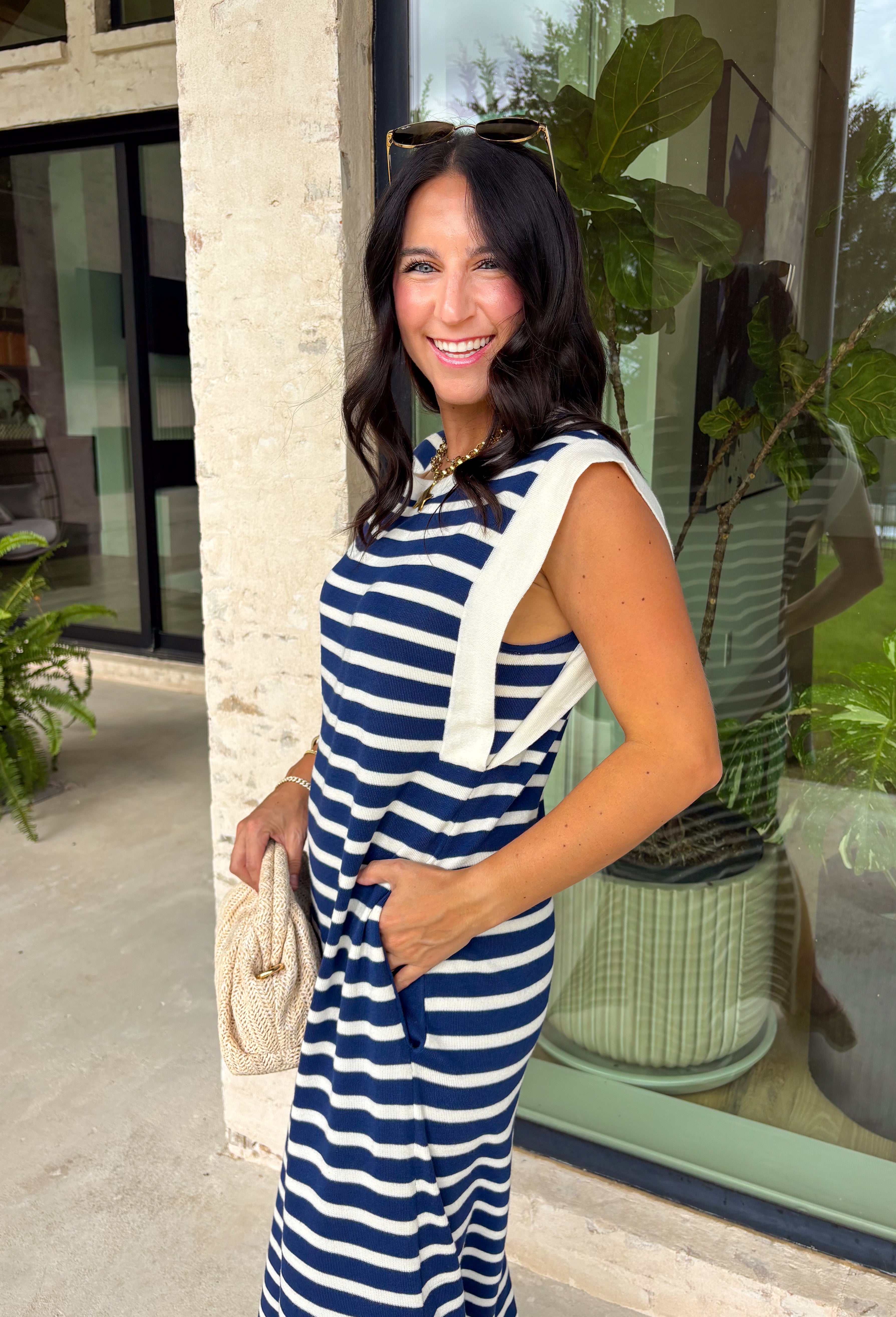 This navy and off white striped maxi dress is the effortless summer staple you'll reach for again and again! The classic stripe print gives it a timeless, coastal-inspired feel, while the contrast rib trim at the neckline and armholes adds a sporty touch. Lightweight and incredibly comfortable, it has that easy throw-on-and-go style that works for everything from vacation days to weekend errands. And with side pockets (always a win), it's as practical as it is cute. 