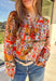 Bring bold color and cheerful energy to your fall wardrobe with this long sleeve floral top by Fate. The mix of orange, off white, tan, brown, purple, and blue creates a stunning statement print that feels both playful and timeless. Designed with a subtle ruffle neckline and a front tie detail, this blouse adds a soft feminine finish to your everyday look.