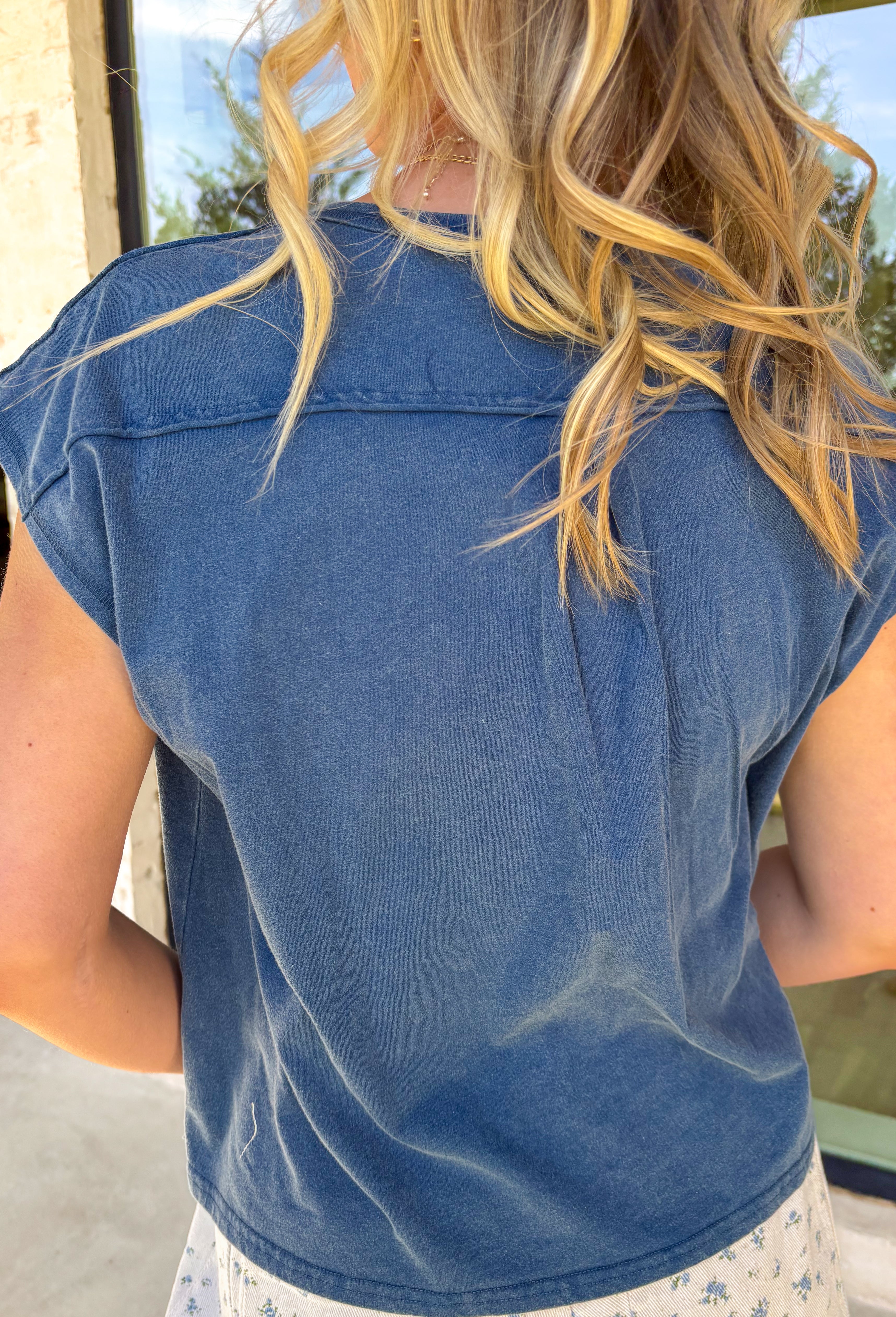 An everyday staple you’ll reach for again and again! This navy short sleeve henley top keeps things simple, classic, and effortlessly comfortable. The henley-style neckline adds a casual, laid-back detail that makes it feel a little more polished than your basic tee. Made from lightweight 100% cotton, it’s breathable and easy to wear all day long. 