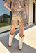 Bring a little wild style to your fall wardrobe with this neutral zebra print skort. Made from 100% cotton denim, it combines the look of a skirt with the easy wear of shorts for a fun piece you can dress up or down. The asymmetric front gives it a modern twist, while the zip-fly button closure and elastic waistband at the back create a comfortable fit. Front pockets and back patch pockets add practical finishing touches. 