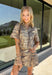 Take a walk on the wild side with this neutral zebra print top from Entro. Made from 100% cotton denim, it gives the classic animal print a fresh, structured feel that's perfect for transitioning into fall. The shirt collar keeps the look classic, while short sleeves and front patch pockets add a casual, laid-back touch. 