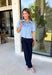 Give your everyday wardrobe a fresh update with this beautifully crafted faux suede top from Day + Moon. Designed in a soft light blue hue, this elevated button-down features a feminine scalloped collar that adds the perfect touch of charm. The short cuffed sleeves and classic button-front design create a polished silhouette that's easy to style for any occasion. 