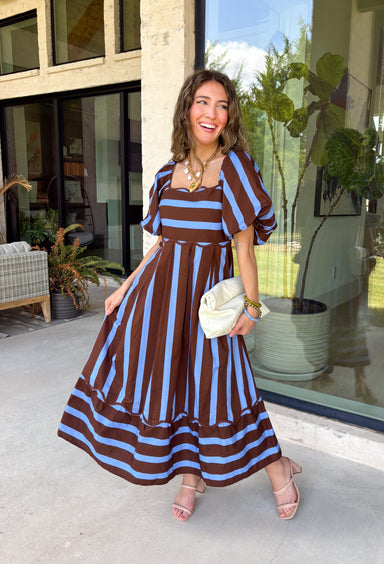 Brown and blue come together in the prettiest way on this striped midi dress from Entro. The scalloped square neckline gives the classic stripe print a sweet, unexpected touch, while short puff sleeves add just the right amount of shape. A smocked back creates a comfortable fit that moves with you, and convenient side pockets make this one even easier to love. 