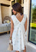 Light, airy, and made for sunny spring days, this white floral eyelet lace dress is as sweet as it gets. Dainty blue floral embroidery is scattered throughout, adding the prettiest pop of color against the crisp white backdrop. The eyelet lace texture gives it that timeless, feminine feel we all love this time of year. Designed with a flattering v-neckline and finished with a blue tassel tie detail, this dress blends charm and comfort effortlessly. 