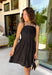 Every closet deserves a timeless little black dress, and this one is sure to become your new favorite! Designed with a flattering straight neckline and chic pleated bodice, this dress offers a polished look that's perfect for any occasion. Adjustable shoulder straps and a smocked back provide a comfortable, customizable fit, while side pockets add the practical detail everyone loves. 