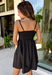 Every closet deserves a timeless little black dress, and this one is sure to become your new favorite! Designed with a flattering straight neckline and chic pleated bodice, this dress offers a polished look that's perfect for any occasion. Adjustable shoulder straps and a smocked back provide a comfortable, customizable fit, while side pockets add the practical detail everyone loves. 