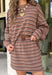 Bring warm, easy neutrals into your fall wardrobe with this striped skort from Day + Moon. Designed with a tan base and classic brown and ivory stripes, it has that effortless autumn color palette that pairs with just about everything. The elastic waistband keeps the fit comfortable, while the skort design gives you the look of a skirt with the ease and coverage of shorts. 