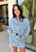 Classic stripes get a fresh update with this long sleeve top from Day + Moon. The light blue base is paired with navy and white stripes for a crisp color combination that’s easy to wear throughout the season. Made from a soft cotton blend with a touch of stretch, it keeps you comfortable whether you’re heading to work, running errands, or making weekend plans. 