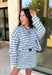 Classic stripes get a fresh update with this long sleeve top from Day + Moon. The light blue base is paired with navy and white stripes for a crisp color combination that’s easy to wear throughout the season. Made from a soft cotton blend with a touch of stretch, it keeps you comfortable whether you’re heading to work, running errands, or making weekend plans. 