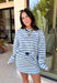 Classic stripes get a fresh update with this long sleeve top from Day + Moon. The light blue base is paired with navy and white stripes for a crisp color combination that’s easy to wear throughout the season. Made from a soft cotton blend with a touch of stretch, it keeps you comfortable whether you’re heading to work, running errands, or making weekend plans. 