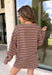 Neutral stripes make this long sleeve top from Day + Moon an easy favorite for the season. The tan base is paired with brown and ivory stripes for a warm color combination that fits right in with your fall wardrobe. Made from a soft cotton blend with a touch of stretch, it offers plenty of comfort for everything from workdays to weekend plans. 
