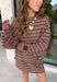 Neutral stripes make this long sleeve top from Day + Moon an easy favorite for the season. The tan base is paired with brown and ivory stripes for a warm color combination that fits right in with your fall wardrobe. Made from a soft cotton blend with a touch of stretch, it offers plenty of comfort for everything from workdays to weekend plans. 