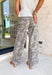 These neutral camo wide leg jeans are the perfect mix of laid-back and statement-making for summer! The neutral camo print keeps them easy to style, while the super wide leg silhouette brings that bold, on-trend look everyone’s loving. Designed with a flattering high-rise fit and just the right amount of stretch, they’re comfortable enough for all-day wear. Pair them with a simple tank or tee and let the jeans do the talking.