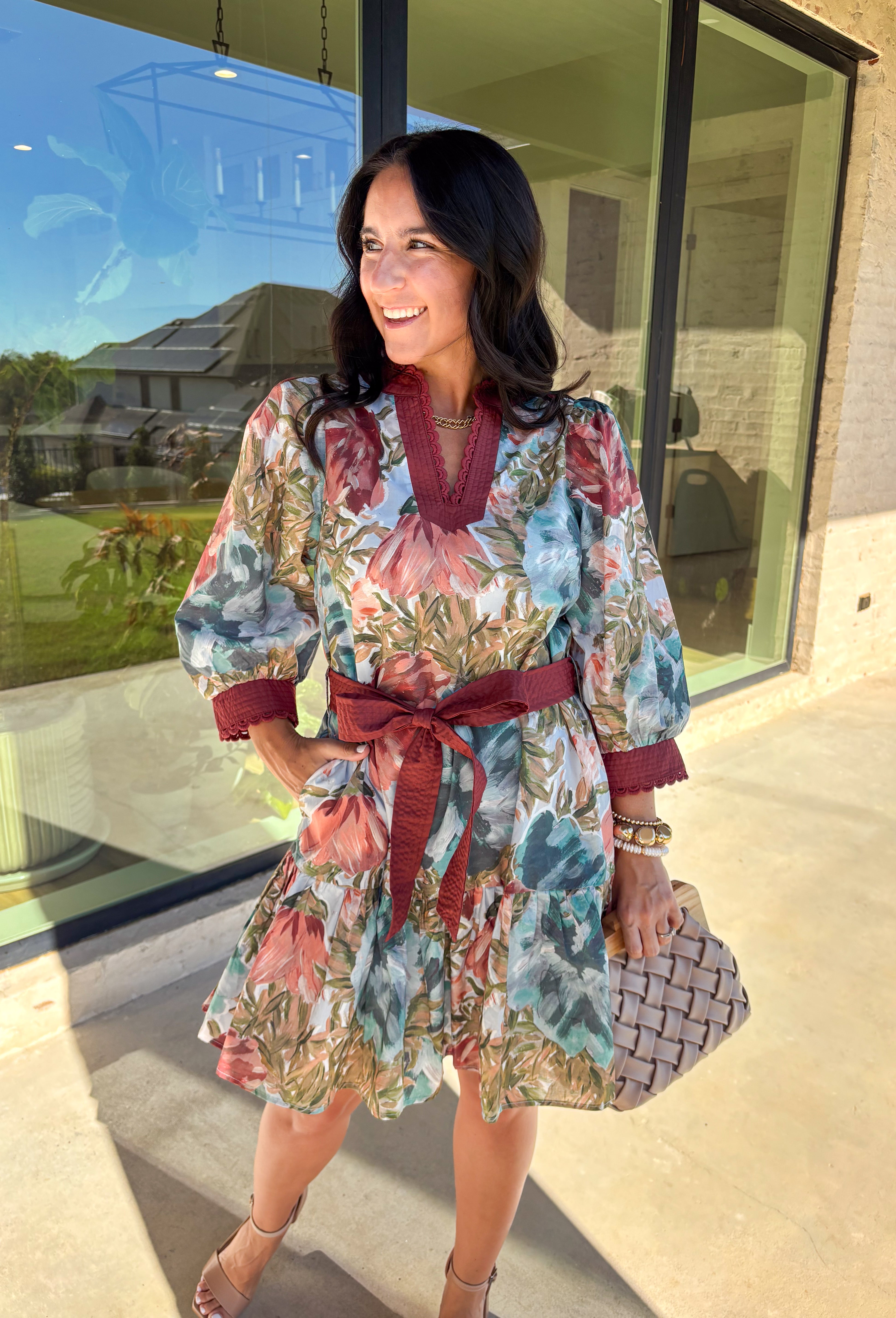 A mix of playful and polished, this dress brings autumn florals to life with a botanical print in rich seasonal shades. The scallop trim along the v-neckline adds a sweet detail, while the self-tie waist belt flatters your shape. Designed with ¾ sleeves, side pockets, and a ruffle hem, it balances comfort and charm. Fully lined for an easy fit, this is a dress you’ll love for everything from casual days to seasonal gatherings.