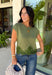 A cozy knit with feminine details is always a fall favorite! This olive short sleeve sweater is the perfect combination of timeless style and everyday comfort. The soft sweater knit feels cozy without being bulky, while the cap sleeves make it ideal for layering under jackets and cardigans throughout the season. Delicate lace trim along the hem adds a beautiful finishing touch, giving this classic piece an elevated feel.