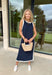 Sleek, simple, and effortlessly chic, this navy sleeveless midi dress by Entro is a fresh spring staple you’ll wear on repeat. Designed with crisp white contrast binding along the neckline, armholes, and hem, it offers a polished look with just the right amount of edge. A side slit adds easy movement, while the lightweight, soft fabric blend keeps it comfortable for warm spring days and breezy evenings.