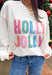 Stay merry and bright this season in the “Holly Jolly” pullover by Main Strip! This soft white lightweight sweatshirt features colorful gingham lettering—each letter a unique mix of festive color and pattern—outlined with white stitching for a playful holiday touch. Cozy and cheerful, it’s the perfect piece for decking the halls, sipping cocoa, or simply spreading a little Christmas joy.
