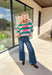 Bring a little merry to your winter wardrobe with this playful “Holly Jolly” pullover by Shiraleah! Designed in pink and green stripes with festive red embroidery across the front, this cozy sweatshirt is equal parts cute and comfortable. Whether you’re wrapping gifts, sipping cocoa, or heading to a holiday get-together, this cheerful piece keeps the spirit bright all season long.