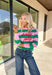Bring a little merry to your winter wardrobe with this playful “Holly Jolly” pullover by Shiraleah! Designed in pink and green stripes with festive red embroidery across the front, this cozy sweatshirt is equal parts cute and comfortable. Whether you’re wrapping gifts, sipping cocoa, or heading to a holiday get-together, this cheerful piece keeps the spirit bright all season long.