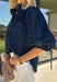 A classic denim top is a wardrobe staple, and this beautifully detailed top from Entro is one you'll wear on repeat. Designed in a rich dark wash denim, this timeless piece features a gold button-front design that makes it easy to style for any occasion. The ¾ puff sleeves add a feminine touch, while the self-tie cuffs create a charming finishing detail.