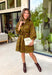 A timeless print meets effortless sophistication in this stunning long sleeve dress. Designed in a rich olive hue with a brown zebra print, this dress offers a fresh take on a classic fall look. The button-front design and matching self-tie belt create a flattering, customizable silhouette, while the soft ruffle neckline adds just the right touch of feminine charm. 