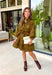 A timeless print meets effortless sophistication in this stunning long sleeve dress. Designed in a rich olive hue with a brown zebra print, this dress offers a fresh take on a classic fall look. The button-front design and matching self-tie belt create a flattering, customizable silhouette, while the soft ruffle neckline adds just the right touch of feminine charm. 
