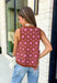 Bold florals and cozy knits make the perfect combination for fall! This sleeveless sweater features a beautiful pink and rust floral pattern that brings a feminine touch to your seasonal wardrobe. Finished with contrast ribbed trim, this lightweight knit is perfect for layering under your favorite blazer, or denim jacket as the weather cools. Whether you're heading to the office, brunch with friends, or a weekend outing, this versatile sweater tank makes transitioning into autumn effortless and stylish.