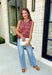 Bold florals and cozy knits make the perfect combination for fall! This sleeveless sweater features a beautiful pink and rust floral pattern that brings a feminine touch to your seasonal wardrobe. Finished with contrast ribbed trim, this lightweight knit is perfect for layering under your favorite blazer, or denim jacket as the weather cools. Whether you're heading to the office, brunch with friends, or a weekend outing, this versatile sweater tank makes transitioning into autumn effortless and stylish.