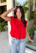 Bring a rich pop of autumn color to your wardrobe with this effortlessly chic red knit top! Designed with a softly gathered round neckline and an elastic hem, it creates a flattering silhouette that's both comfortable and polished. The cap sleeves make it perfect for layering under cardigans, blazers, or denim jackets as the temperatures begin to cool, while the buttery-soft knit fabric makes it one you'll want to wear on repeat. 