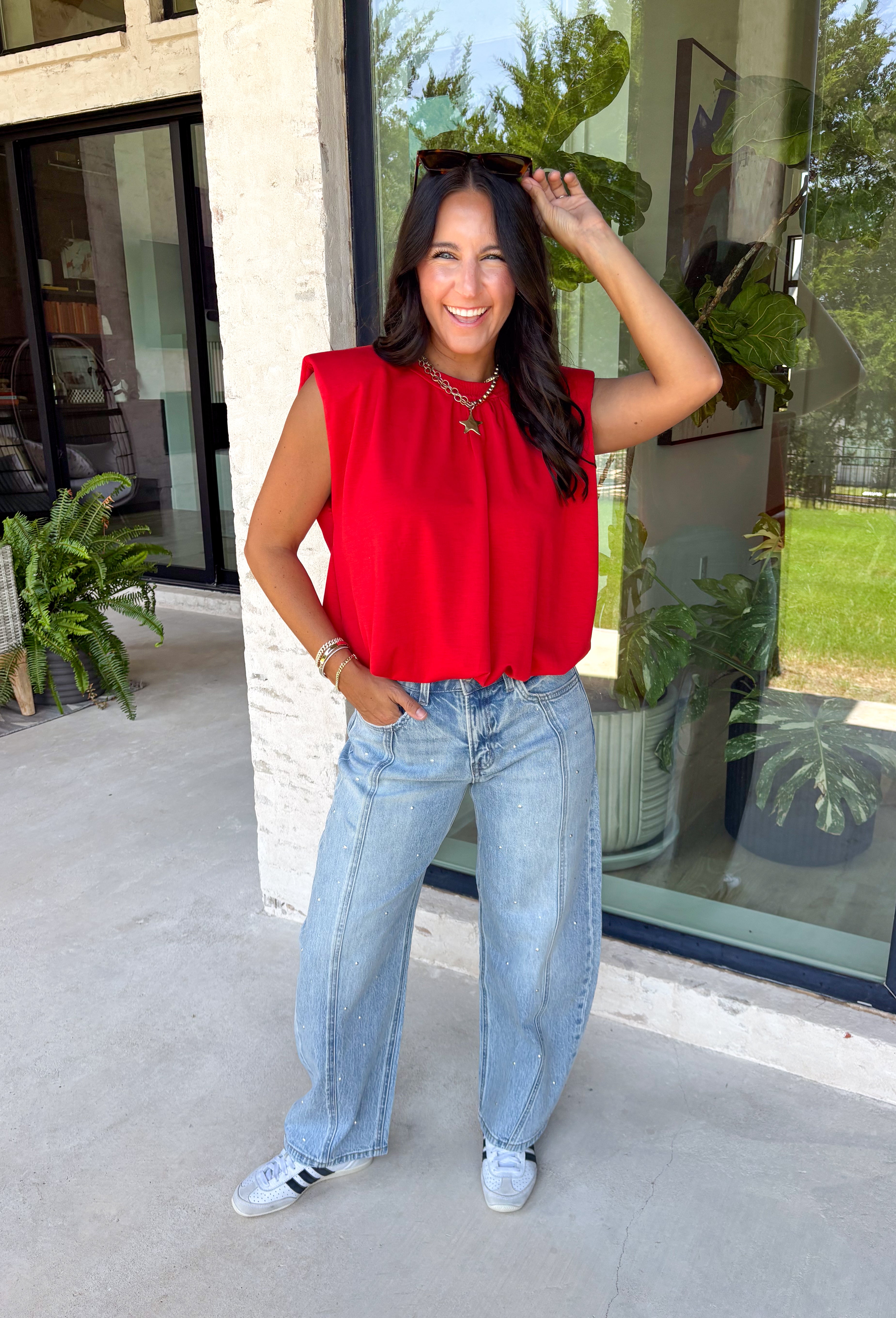 Bring a rich pop of autumn color to your wardrobe with this effortlessly chic red knit top! Designed with a softly gathered round neckline and an elastic hem, it creates a flattering silhouette that's both comfortable and polished. The cap sleeves make it perfect for layering under cardigans, blazers, or denim jackets as the temperatures begin to cool, while the buttery-soft knit fabric makes it one you'll want to wear on repeat. 