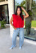 Bring a rich pop of autumn color to your wardrobe with this effortlessly chic red knit top! Designed with a softly gathered round neckline and an elastic hem, it creates a flattering silhouette that's both comfortable and polished. The cap sleeves make it perfect for layering under cardigans, blazers, or denim jackets as the temperatures begin to cool, while the buttery-soft knit fabric makes it one you'll want to wear on repeat. 