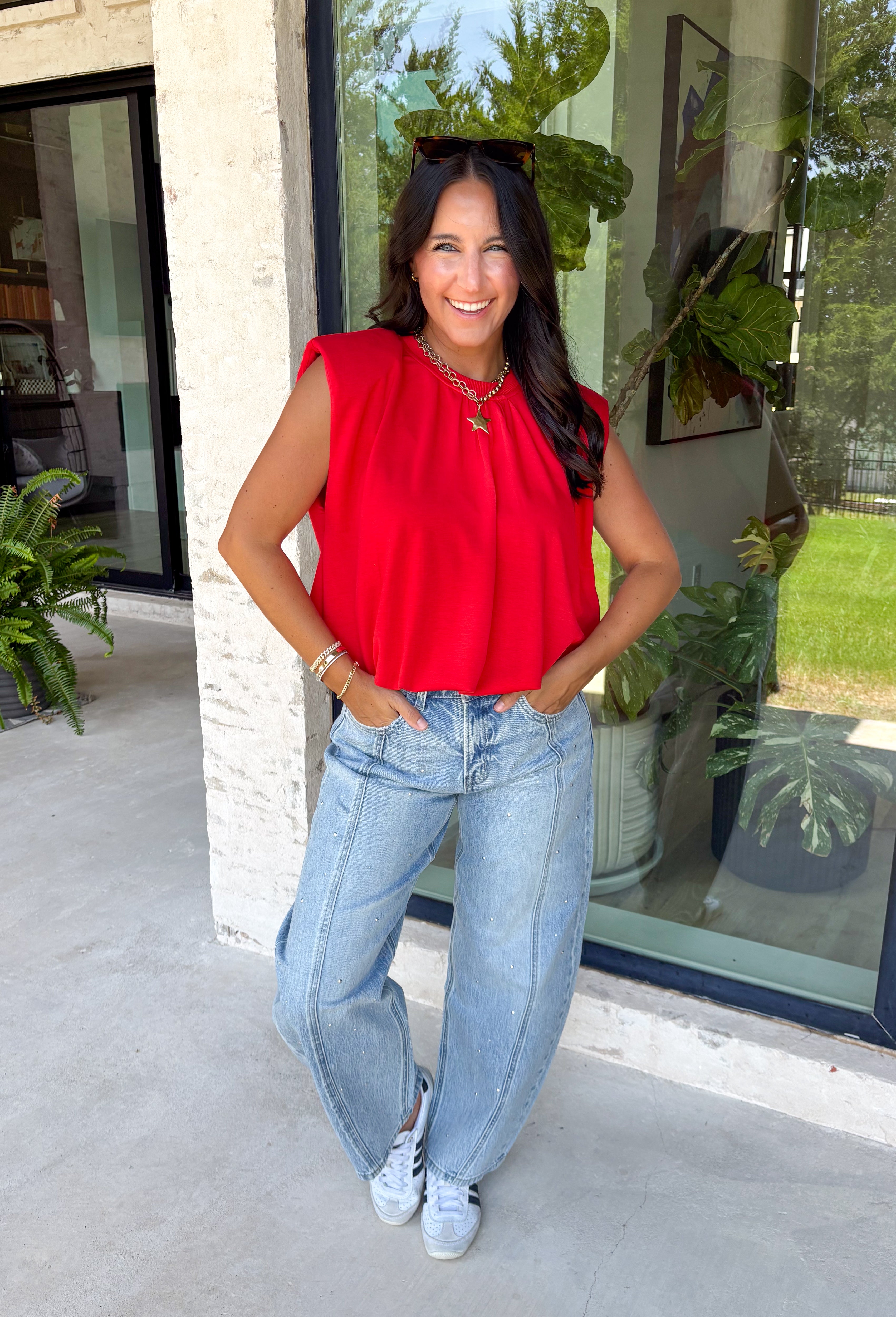Bring a rich pop of autumn color to your wardrobe with this effortlessly chic red knit top! Designed with a softly gathered round neckline and an elastic hem, it creates a flattering silhouette that's both comfortable and polished. The cap sleeves make it perfect for layering under cardigans, blazers, or denim jackets as the temperatures begin to cool, while the buttery-soft knit fabric makes it one you'll want to wear on repeat. 