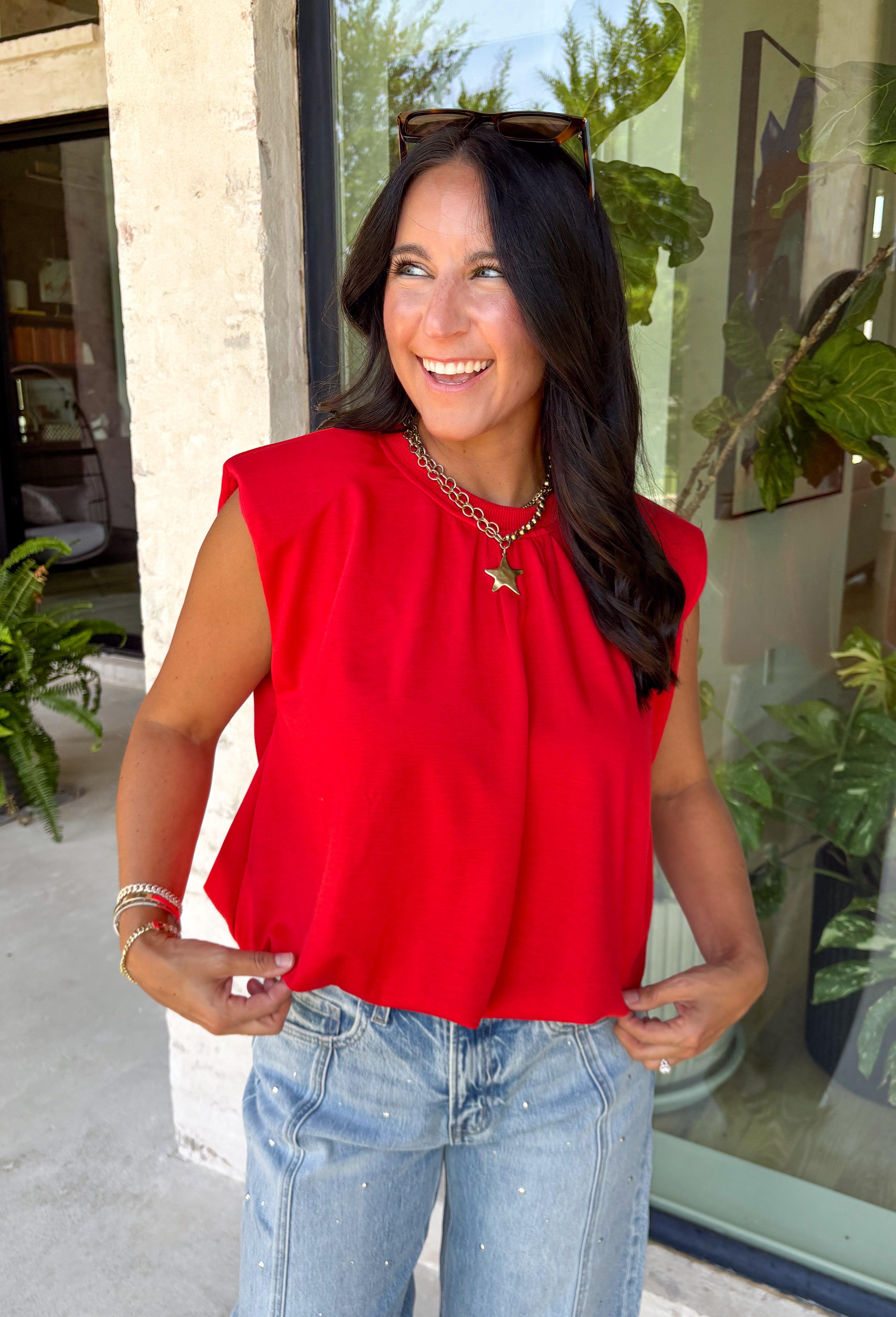 Bring a rich pop of autumn color to your wardrobe with this effortlessly chic red knit top! Designed with a softly gathered round neckline and an elastic hem, it creates a flattering silhouette that's both comfortable and polished. The cap sleeves make it perfect for layering under cardigans, blazers, or denim jackets as the temperatures begin to cool, while the buttery-soft knit fabric makes it one you'll want to wear on repeat. 