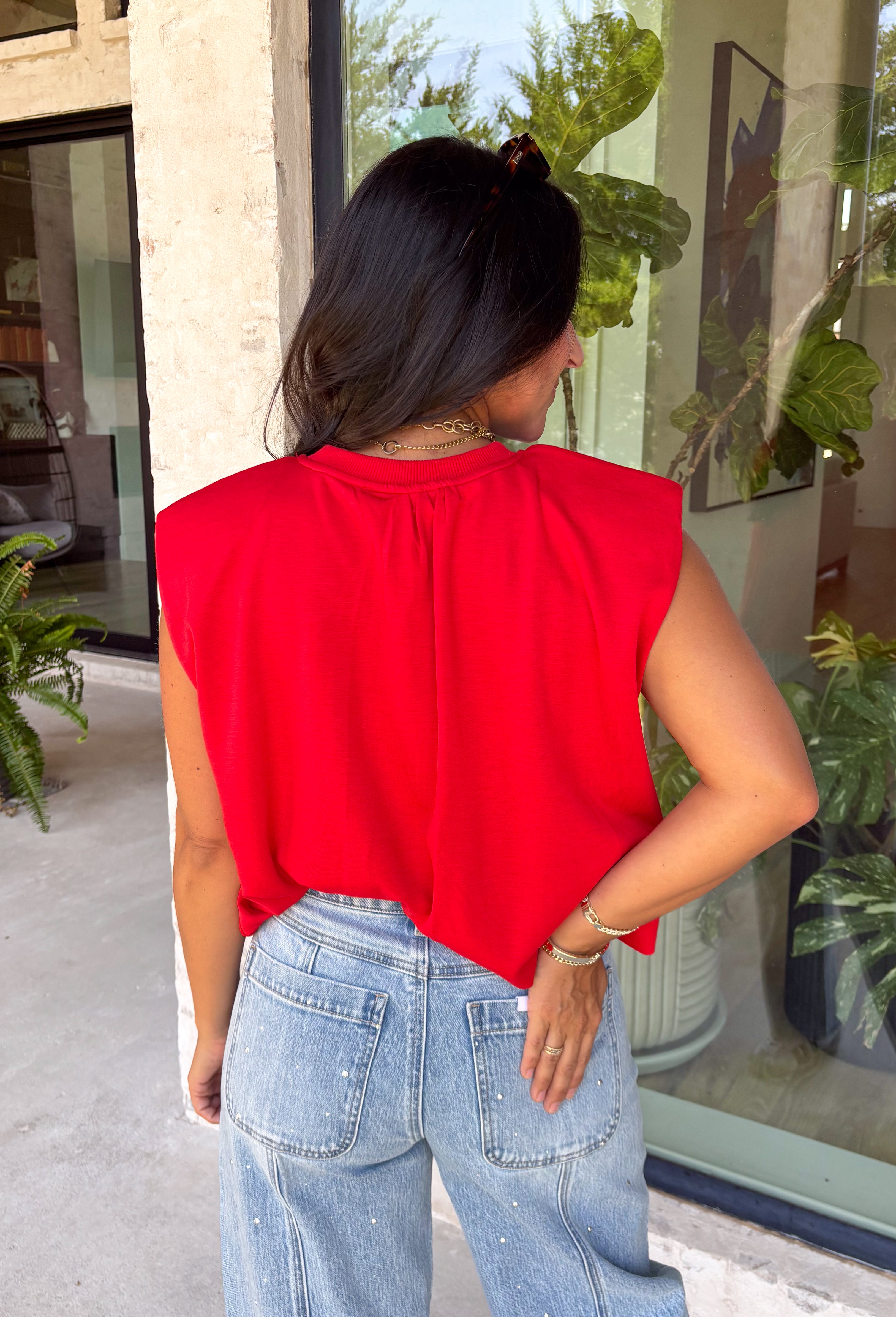 Bring a rich pop of autumn color to your wardrobe with this effortlessly chic red knit top! Designed with a softly gathered round neckline and an elastic hem, it creates a flattering silhouette that's both comfortable and polished. The cap sleeves make it perfect for layering under cardigans, blazers, or denim jackets as the temperatures begin to cool, while the buttery-soft knit fabric makes it one you'll want to wear on repeat. 