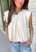 Say hello to your new favorite neutral top! Designed with a softly gathered round neckline and an elastic hem, it creates a flattering silhouette that's both comfortable and polished. The cap sleeves make it perfect for layering under cardigans, blazers, or denim jackets as the temperatures begin to cool, while the buttery-soft knit fabric makes it one you'll want to wear on repeat.