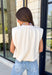 Say hello to your new favorite neutral top! Designed with a softly gathered round neckline and an elastic hem, it creates a flattering silhouette that's both comfortable and polished. The cap sleeves make it perfect for layering under cardigans, blazers, or denim jackets as the temperatures begin to cool, while the buttery-soft knit fabric makes it one you'll want to wear on repeat.