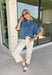 A timeless denim shirt is a wardrobe essential, and this one is designed to go with everything. Crafted from soft medium wash denim with warm tan contrast stitching throughout, this classic button-down top offers effortless style for every season. The collared neckline and front pocket give it a timeless look, while the short sleeves make it perfect for layering or wearing on its own. 