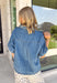 A timeless denim shirt is a wardrobe essential, and this one is designed to go with everything. Crafted from soft medium wash denim with warm tan contrast stitching throughout, this classic button-down top offers effortless style for every season. The collared neckline and front pocket give it a timeless look, while the short sleeves make it perfect for layering or wearing on its own. 