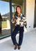 Add a little western-inspired flair to your layering collection with this standout denim jacket from Entro. Designed with a striking cream and black cowhide-inspired print, this timeless piece brings the perfect mix of classic denim styling and bold personality. The collared neckline and button-front closure create a polished, everyday look, while the front pockets add both style and function.