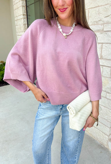 Wrap yourself in effortless comfort with this dreamy dusty lilac sweater! Featuring an oversized silhouette and soft knit fabric, it's the perfect piece for cool mornings, cozy evenings, and everything in between. Pair it with your favorite denim now, then layer it with a vest or jacket as the seasons begin to change for an easy, everyday look.