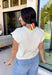 Say hello to your new spring layering favorite! This cream lightweight knit sweater by Entro is the kind of easy, everyday piece that makes getting dressed feel effortless (and cute). With its button-down front and soft sweater knit feel, it gives you that polished “I tried” look while still being comfy enough to wear all day. The short sleeves keep it breezy for warmer weather, but it’s also perfect for those mornings that start chilly and end sunny.