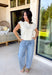 Say hello to your new spring layering favorite! This cream lightweight knit sweater by Entro is the kind of easy, everyday piece that makes getting dressed feel effortless (and cute). With its button-down front and soft sweater knit feel, it gives you that polished “I tried” look while still being comfy enough to wear all day. The short sleeves keep it breezy for warmer weather, but it’s also perfect for those mornings that start chilly and end sunny.