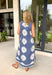 This denim blue floral midi dress is the perfect mix of bold and effortless for summer! The off white bold floral print pops beautifully against the rich blue base, making it such an easy statement piece. The white trim detail along the front adds a clean, polished touch, while the side slits give it that breezy, laid-back feel for warm days. Lightweight with a soft drape and finished with side pockets (always a win), it’s perfect for everything from casual outings to vacation plans. 