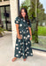 Timeless style meets effortless charm in this beautiful polka dot midi dress. Featuring a rich hunter green backdrop with a bold neutral polka dot print, this classic silhouette is one you'll love wearing year after year. The button-front design and adjustable self-tie waist create a flattering, feminine fit, while the puff sleeves add just the right amount of romantic detail. Complete with side pockets and a fully lined design, this cotton dress is as practical as it is polished.