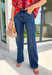 A great pair of classic denim is a must-have in every wardrobe, and these wide leg jeans from Flying Monkey are a style you'll wear season after season. Designed in a rich dark wash with a clean, timeless finish, these jeans offer endless styling possibilities. The flattering mid-rise waist and modern wide leg silhouette create an effortlessly polished look, while the soft stretch denim keeps you comfortable all day long.