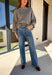 Make your winter wardrobe shine with these statement-making straight jeans by Just Black Denim. Designed in a classic medium wash with a flattering high rise, these standout denim gems are covered in silver rhinestones from front to back for the perfect touch of sparkle. With a structured yet comfortable fit, they’re ready for holiday parties, festive nights out, or whenever you want to turn heads.