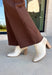 These chocolate brown jeans from Just Black Denim are the perfect blend of timeless style and everyday versatility. Designed with a flattering slim wide leg silhouette, they create an effortlessly elevated look that's easy to dress up or down. The rich chocolate brown color offers a fresh alternative to traditional denim, while the raw edge hem adds a modern finishing touch. Crafted with just the right amount of stretch for all-day comfort, these jeans are sure to become a staple in your fall wardrobe.