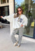 Wear your faith in the coziest way with this heather grey “Jesus” pullover from Bucket List. Each letter features its own unique print, including dainty florals, classic stripes, plaid, and solid navy in a soft mix of neutrals and shades of blue. Light grey embroidery outlines each letter for an extra touch of texture that makes the design stand out beautifully against the heather grey background. 
