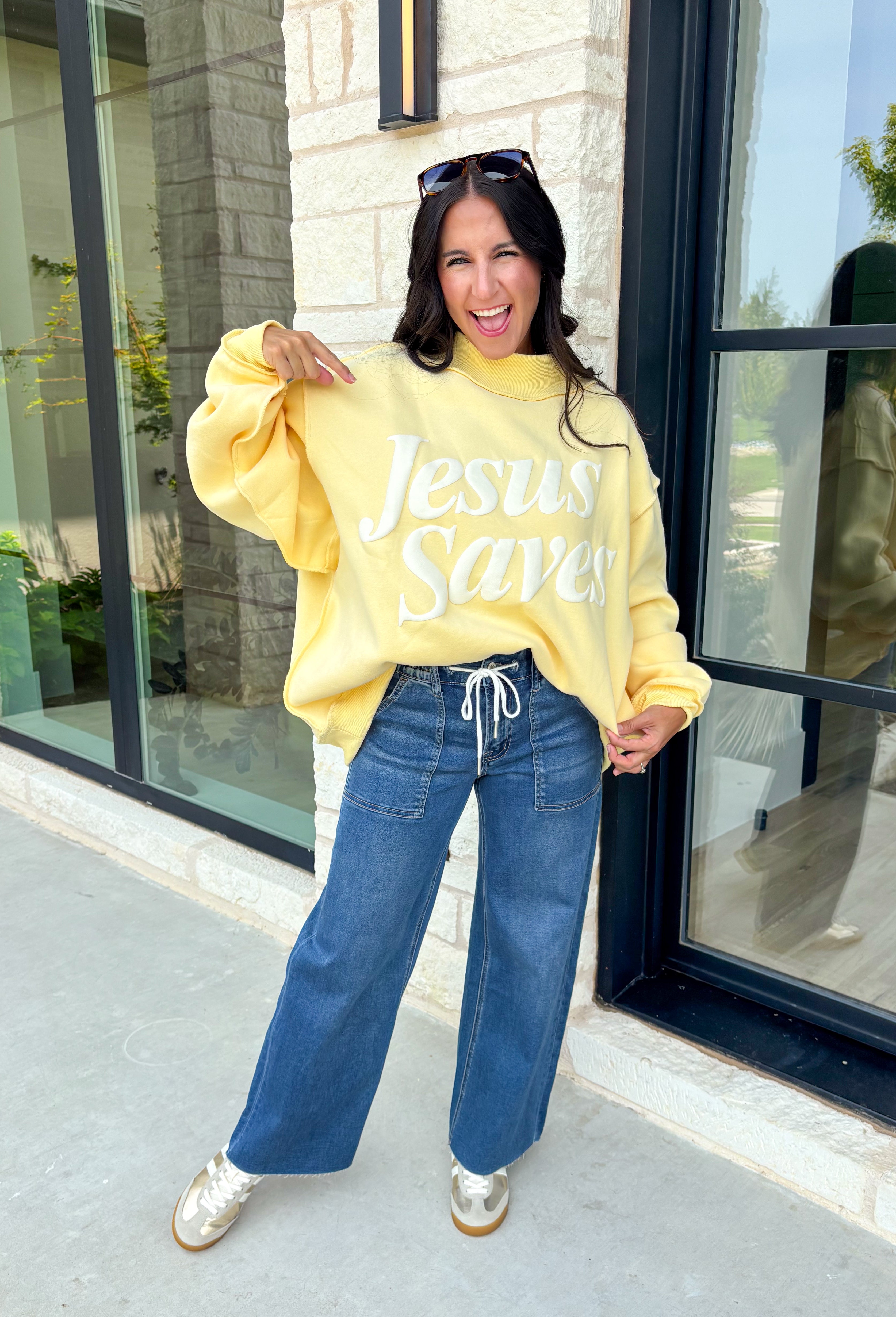 Wrap yourself in faith and comfort with this butter yellow pullover that shares a message worth wearing! Featuring cheerful bubble lettering that reads "Jesus Saves," this cozy soft sweatshirt is the perfect reminder of hope and grace wherever your day takes you. The fleece-lined interior keeps you warm and cozy, while the exposed seam details and ribbed trim give it a laid-back, lived-in feel. 